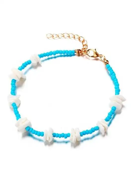 tobillera chaquiras azules y concha blanca