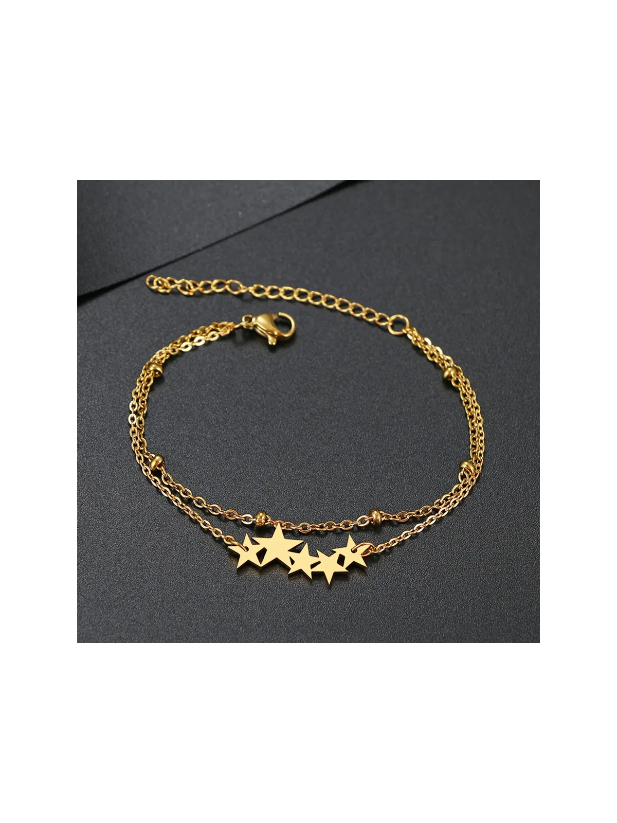 Pulsera doble con estrellas doradas