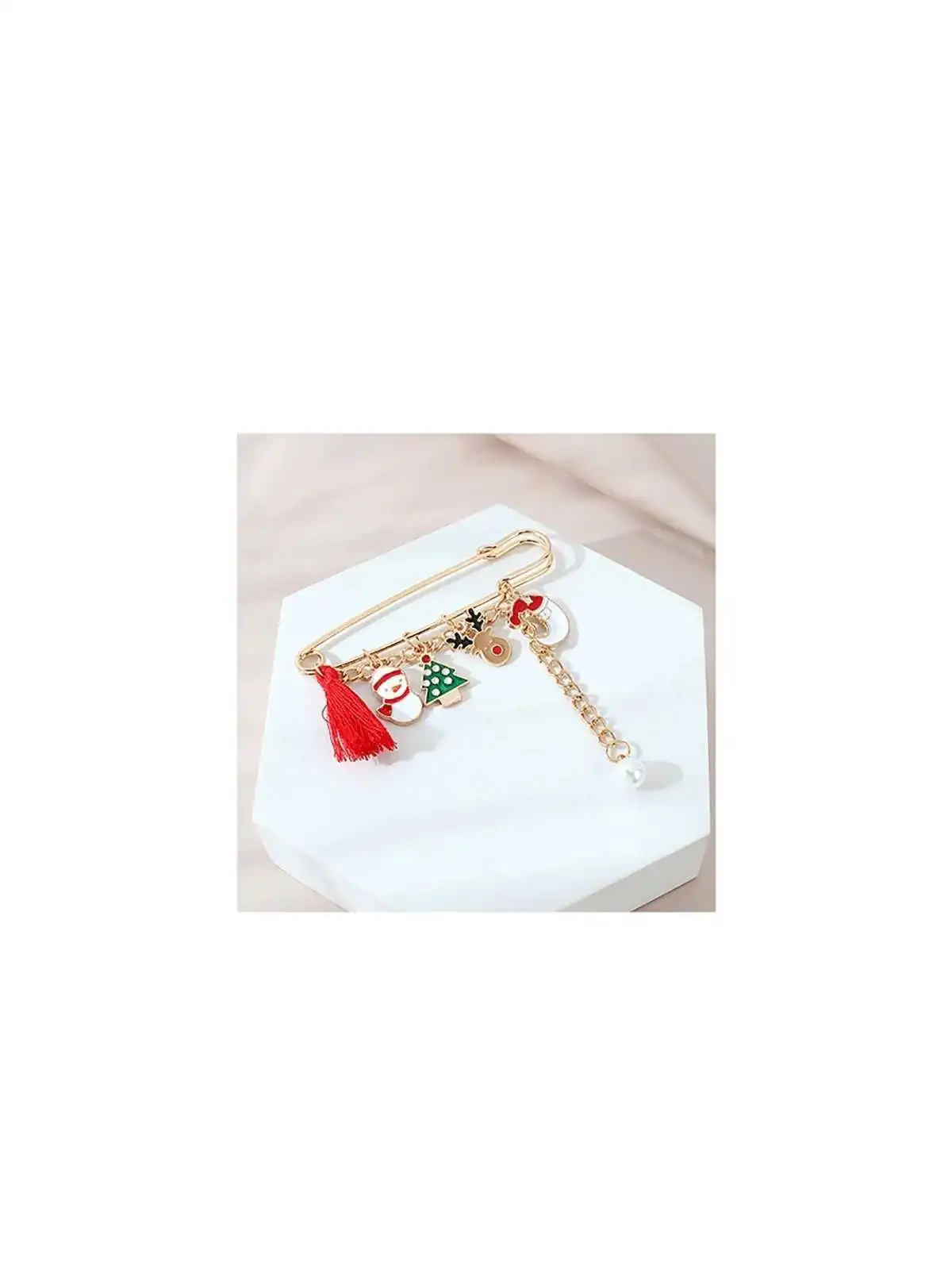 Broche imperdible dorado de la navidad con papa noel