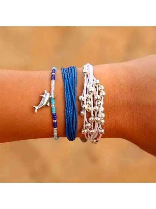 conjunto de tres pulseras de cordon azul y blanco con abalorios