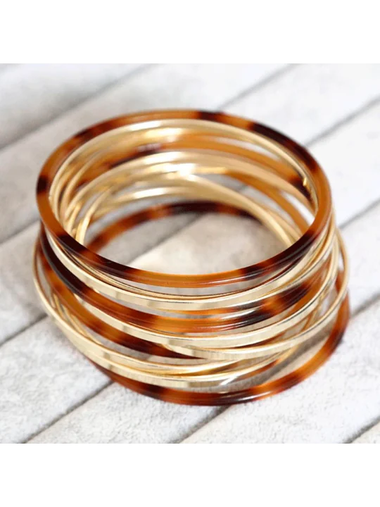 Multipulseras de resina de carey y doradas
