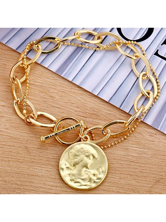 preciosa pulsera con moneda dorada y cadena de eslabones
