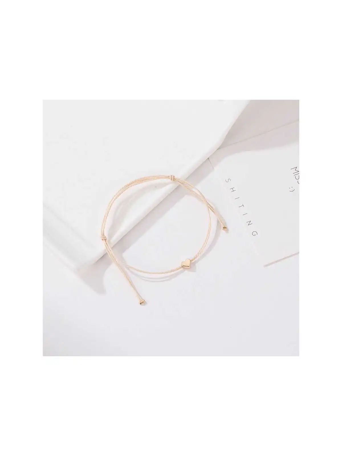pulsera de la amistad cordon beige con corazon