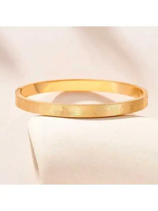 brazalete dorado de las constelaciones 