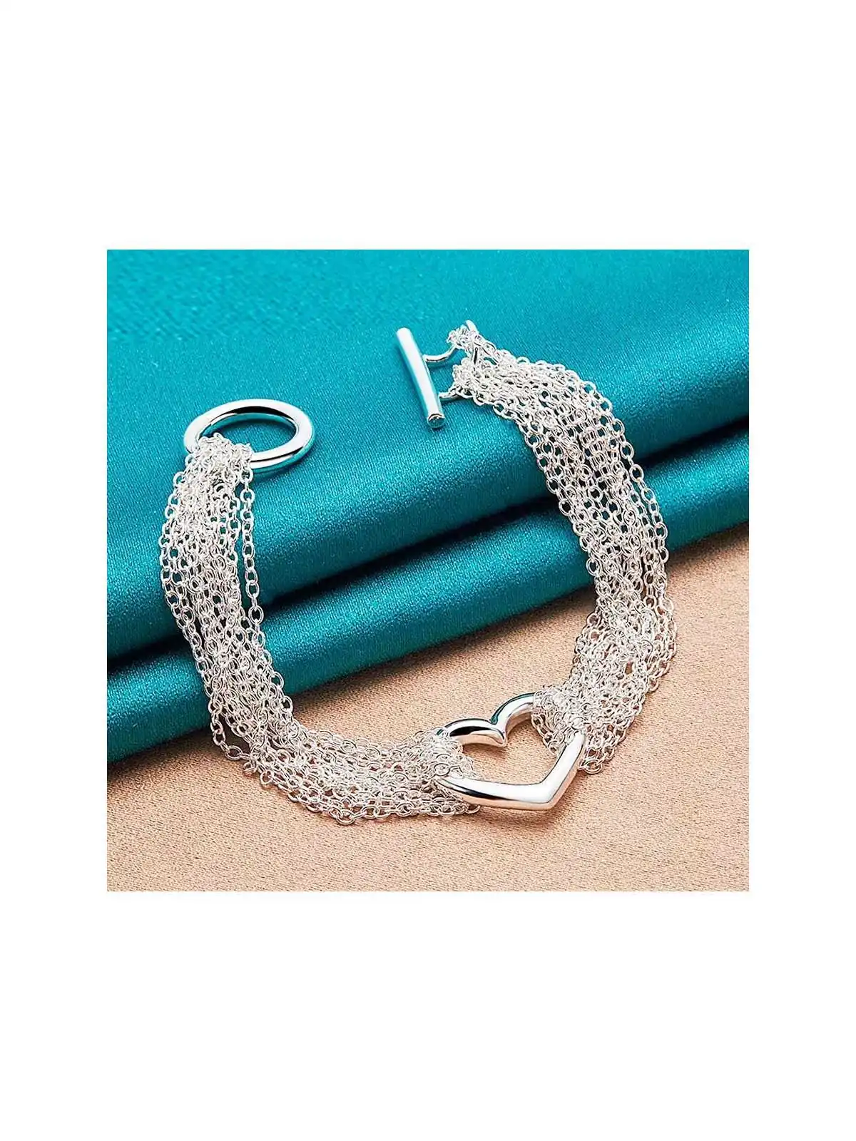 precioso brazalete multicadena plateado con corazon 